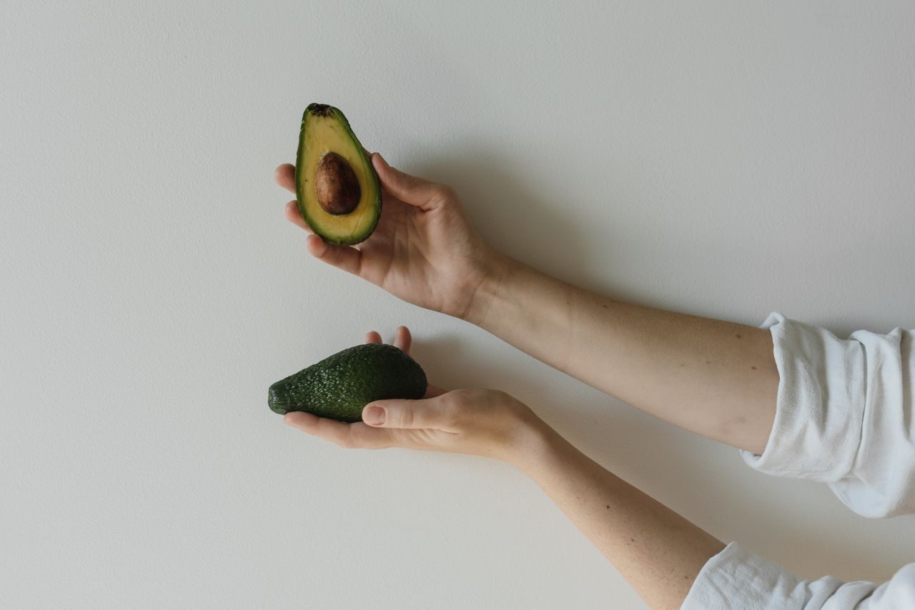 Fresh avocados halved on a table