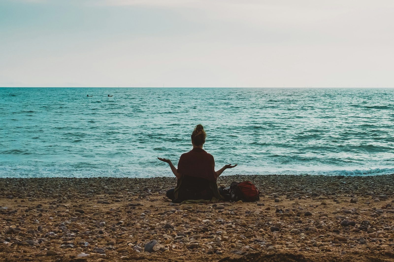 Person meditating peacefully in natural light