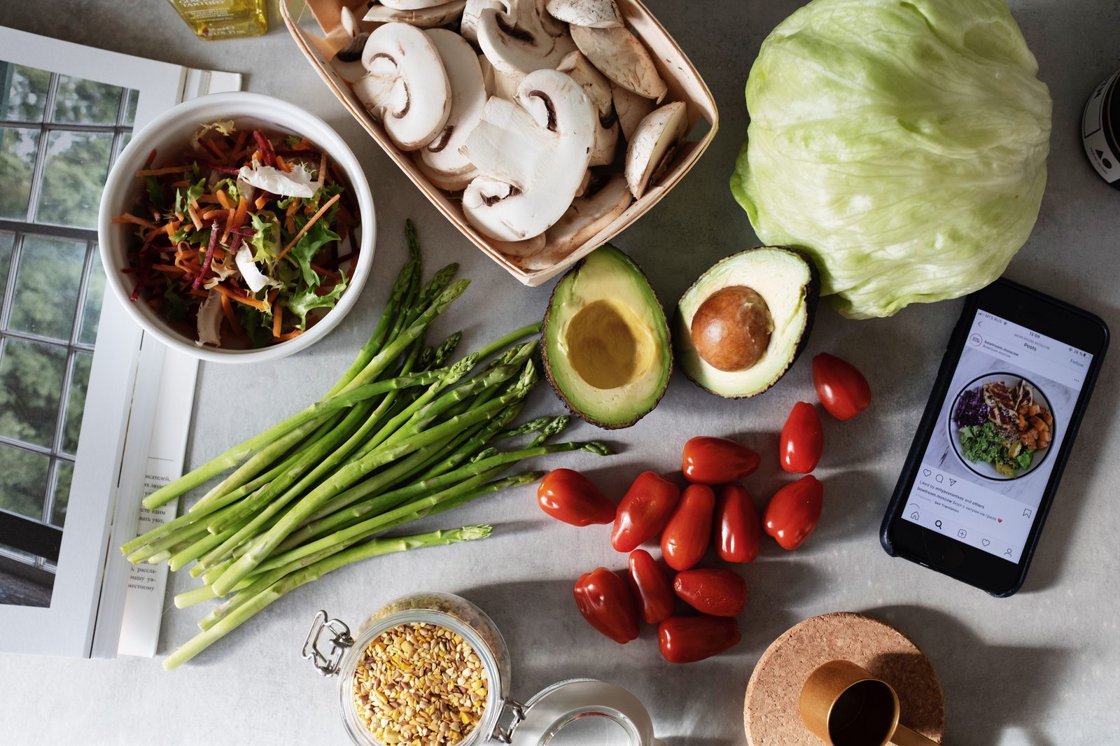Fresh vegetables and plant-based ingredients arranged on a kitchen counter