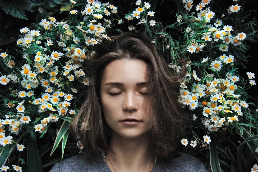 naturopath women sitting amongst plants